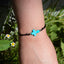 Pulsera de hilo ajustable con cruz de pasta 1mm