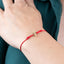 Pulsera hilo rojo broche t de corazon ajustable