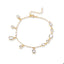 Pulsera circonias geometricas colgantes 21cm
