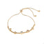 Pulsera ajustable balines dijes de corazon trebol y herradura 26cm