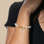 Pulsera ajustable perlas y dije de cruz con circonias 24cm