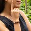 Pulsera de hilo ajustable con cuentas y cruz de madera 8mm