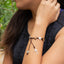 Pulsera de hilo ajustable con cruces de madera y medalla de san benito 9mm