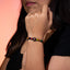 Pulsera de hilo ajustable con cruz y cuentas de madera multicolor 6mm