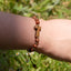 Pulsera de hilo ajustable con cuentas de madera y cruz de tau 6mm